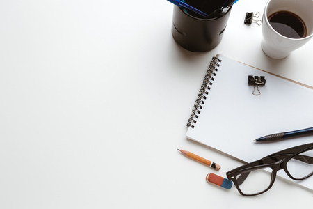 Business Items dropped in creative Disorder on white Tableの写真素材