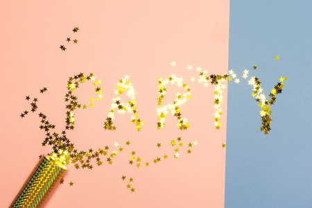 festive party decor and confetti on colored backgroundの写真素材