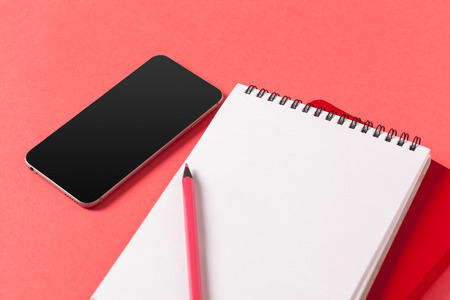 Blank paper pieces  on a colored pink backgroundの写真素材