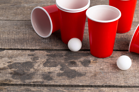 Game Beer Pong on wooden tableの写真素材
