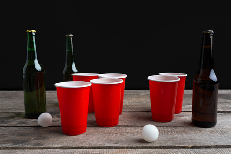 Game Beer Pong on wooden tableの写真素材