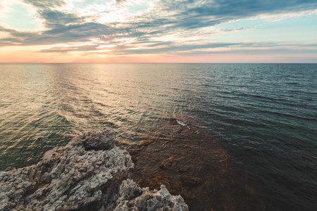 Brilliant vacation destination beach sunrise and sea cliffs backgroundの写真素材