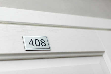 house or hotel room numbers on clear gray surface 408の写真素材