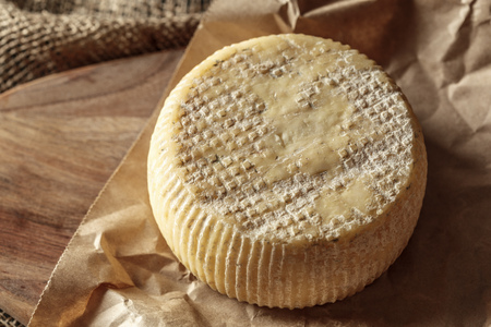 Cheese on the wooden tableの写真素材