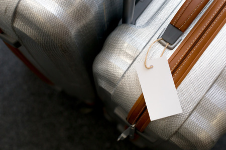 Close up of blank  luggage tag label on a suitcaseの写真素材