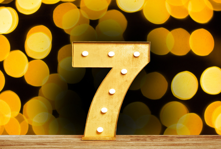 Big plastic numbers with shining light bulbsの写真素材