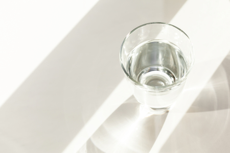 Glass of water on tableの写真素材