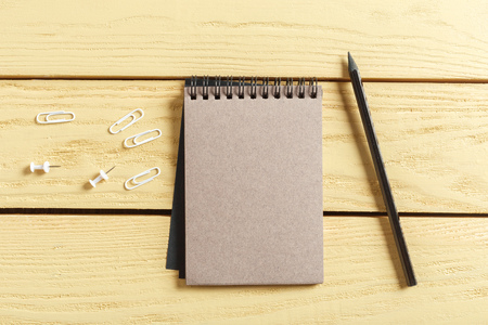 open notepad on wooden background
