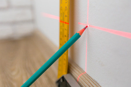 Laser level and lines on the wallの写真素材