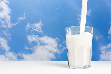 Milk glass on wooden table. Healthy eating conceptの写真素材