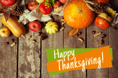 Happy thanksgiving day display on wooden backgroundの写真素材