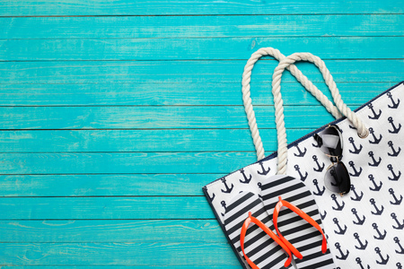 Beach accessories on wooden table.の写真素材