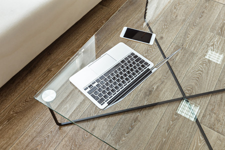 modern glass table in the loft interiorの写真素材