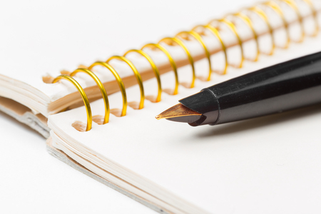 Pen and notebook closeup photoの写真素材