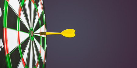 darts arrows in the target centerの写真素材