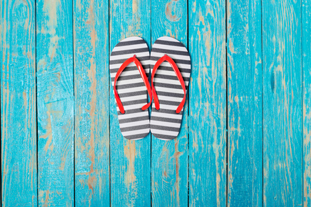 flip-flops on color wooden backgroundの写真素材