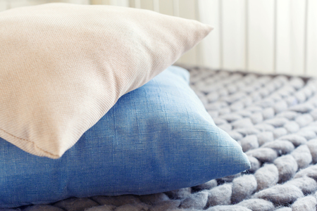 Grey knit giant plaid with pillowsの写真素材