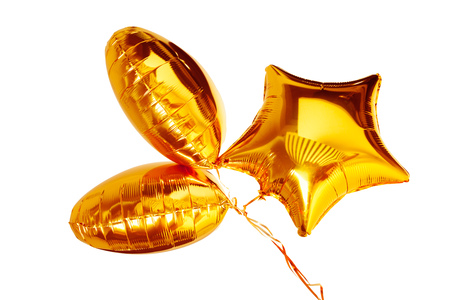 gold big star metallic balloon isolated on whiteの写真素材