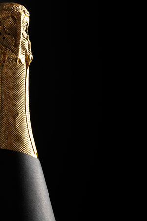Champagne bottle on a black backgroundの写真素材