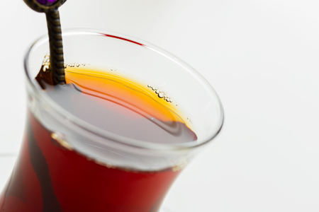 Turkish tea in traditional glass isolated on white backgroundの写真素材