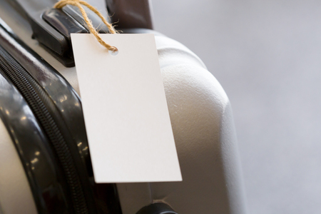 Close up of blank  luggage tag label on a suitcaseの写真素材