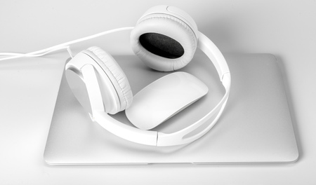 laptop and headphone isolated on white