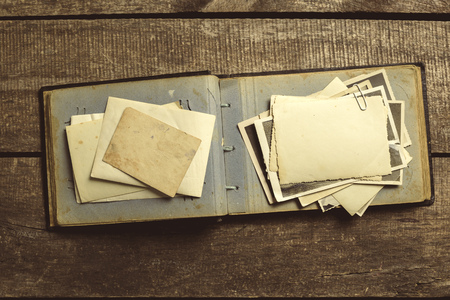 old photos on the wooden tableの写真素材