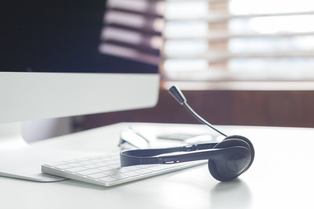 laptop computer with headsetの写真素材