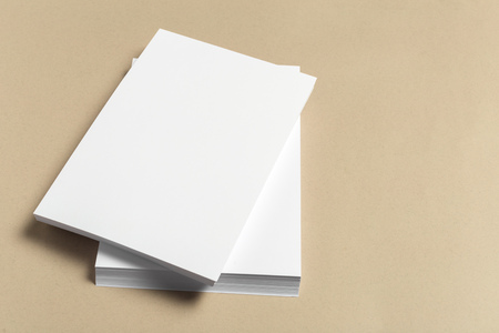 White business card on wooden table. Blank portrait A4.の写真素材