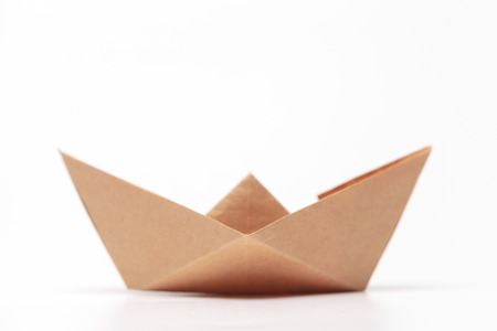 Origami paper boat isolated on white backgroundの写真素材