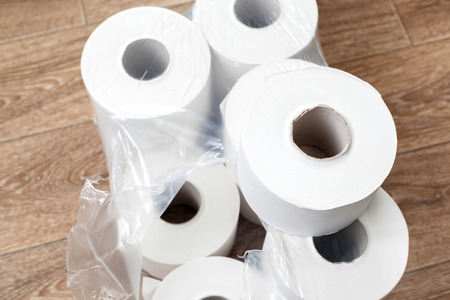 Toilet paper on wood backgroundの写真素材