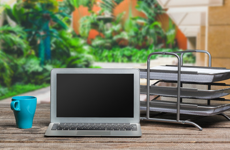 laptop on wooden table