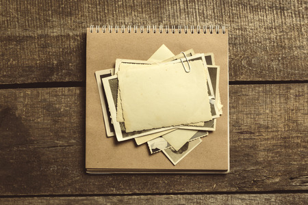 old photos on the wooden tableの写真素材