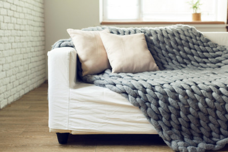 Grey knit giant plaid with pillowsの写真素材