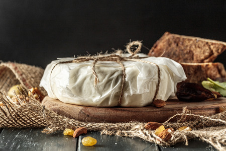 Cheese on the gray wooden tableの写真素材