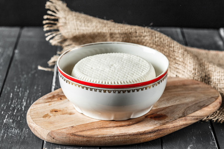 Cheese on the wooden tableの写真素材