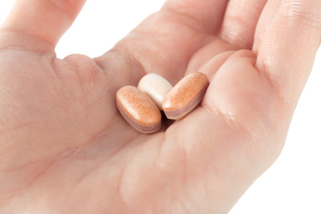 pills in woman hand