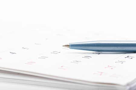 Check out the dates in a business calendar conceptの写真素材