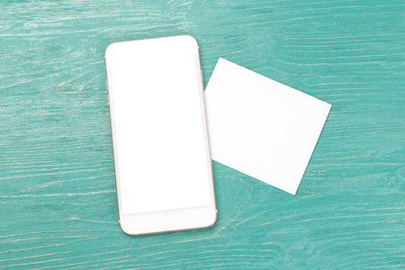 Blank screen Smartphone on wooden table.の写真素材