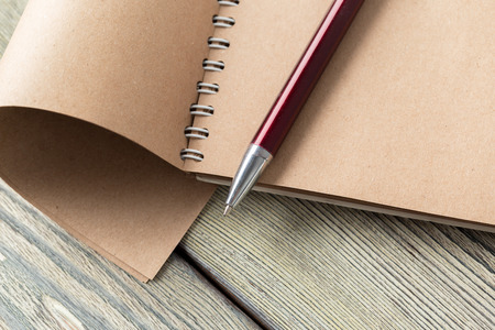 notepad and eyeglasses on the tableの写真素材