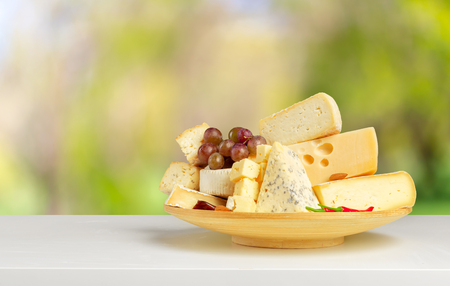 cheese on wooden tableの写真素材