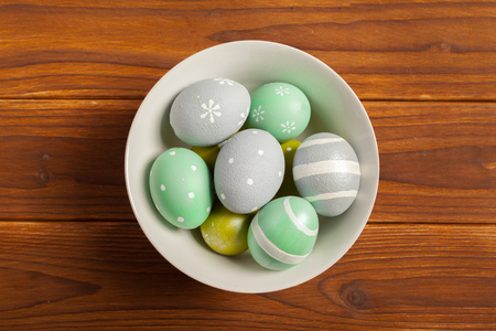 Happy easter! Easter eggs on wooden backgroundの写真素材