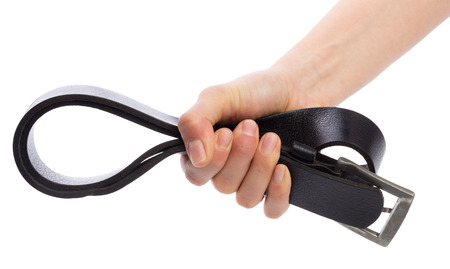 Hand holding leather belt for punishment on white backgroundの写真素材