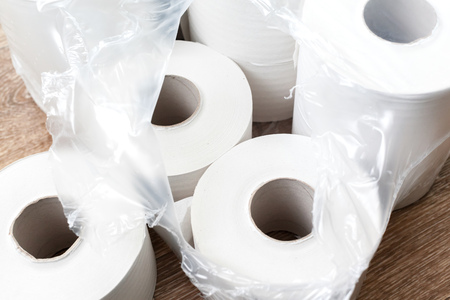 Toilet paper on wood backgroundの写真素材