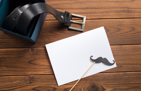 Stylish leather belt on wooden backgroundの写真素材