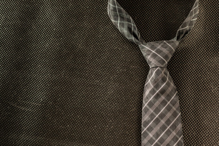 tie on dark background