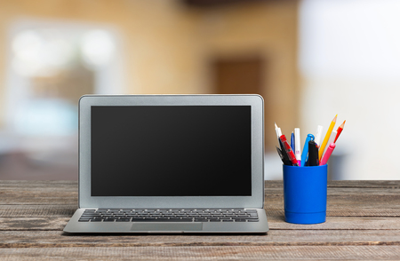 laptop on wooden tableの写真素材