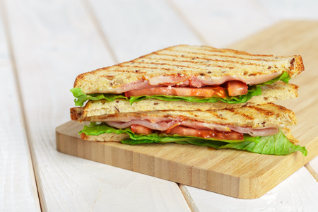 Club sandwich on wooden table