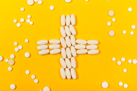 White medical pills on color backgroundの写真素材