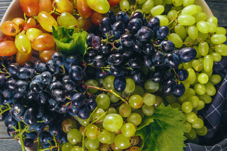 Grapes on a wooden tableの写真素材